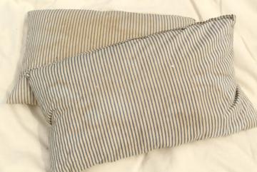 catalog photo of primitive grubby vintage cotton ticking pillows, feather filled bed pillows