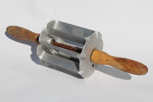 photo of primitive kitchen tool, old rolling pin doughnut cutter to make long john donuts #1