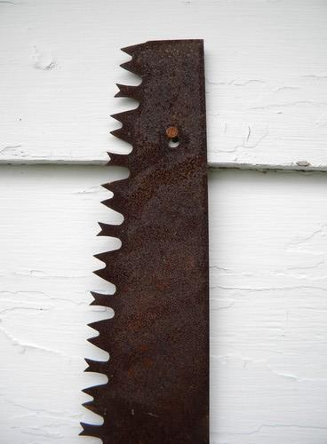 photo of primitive old crosscut saw lumberjack tool north woods cabin or lodge #3