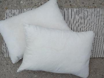 catalog photo of primitive old feather pillows, vintage heavy cotton feed sack fabric