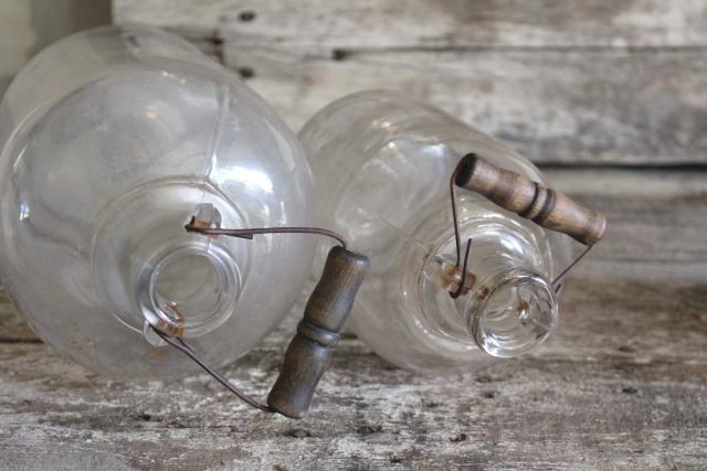 photo of primitive old glass half & gallon bottles, moonshine jug jars w/ wire bail wood handles #8