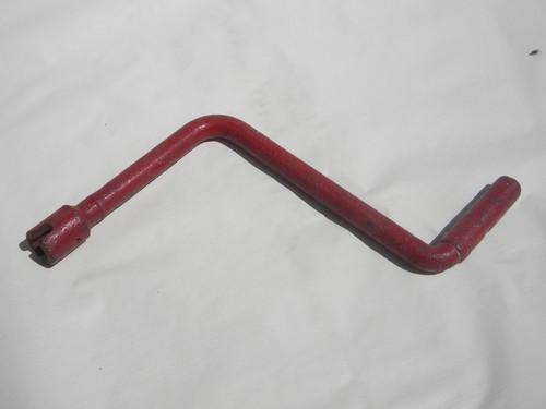 photo of primitive old hand crank for farm implement or tool with old red paint #1