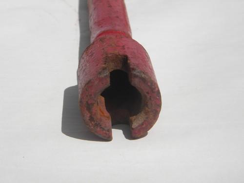 photo of primitive old hand crank for farm implement or tool with old red paint #2