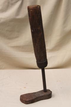 catalog photo of primitive old spoke handled tool, steampunk wood leg antique iron foot form shoe shape