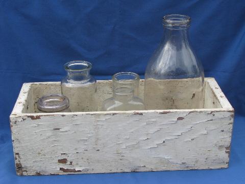 photo of primitive old white paint wood box full of vintage glass bottles #1