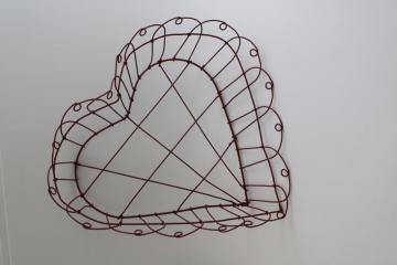 photo of primitive rustic barn red heart basket, vintage hand wrought wire work heart