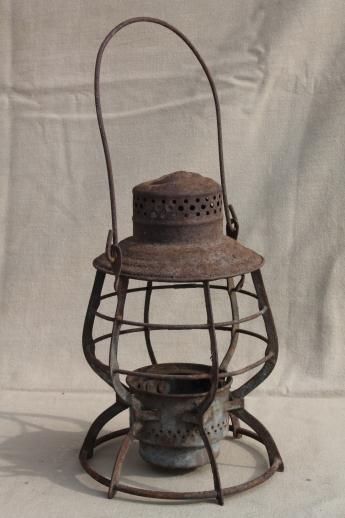 photo of primitive rusty old railroad lantern, old iron lamp cage without glass shade #4