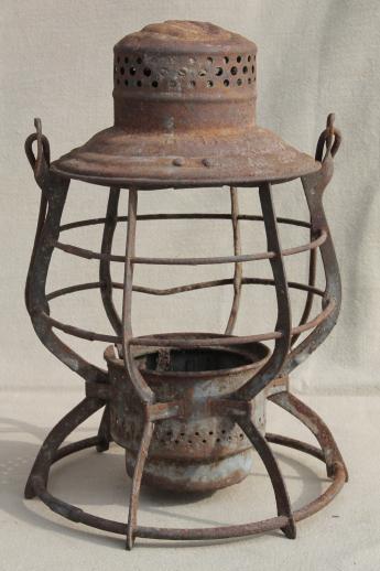 photo of primitive rusty old railroad lantern, old iron lamp cage without glass shade #5