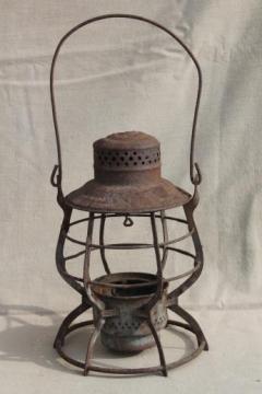 catalog photo of primitive rusty old railroad lantern, old iron lamp cage without glass shade