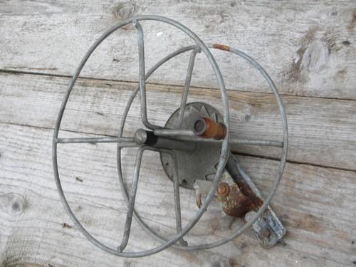 photo of primitive vintage wire winding reel for garden hose, laundry line, rope #1