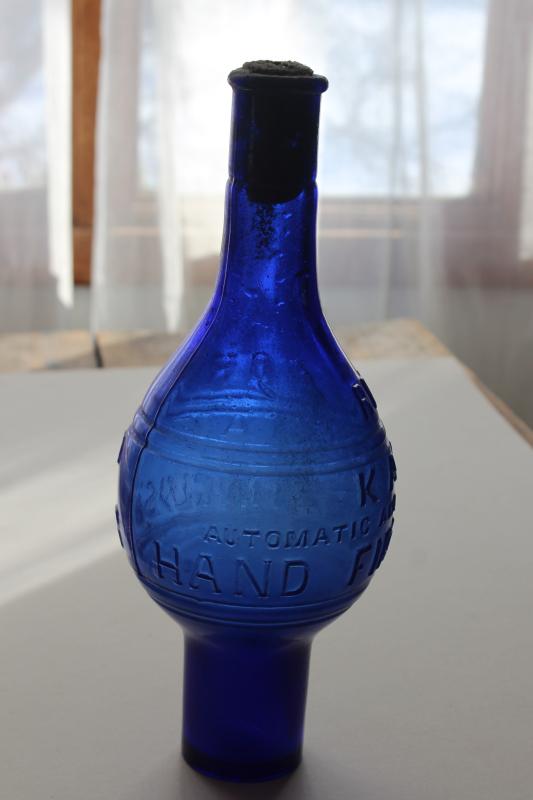 photo of rare antique glass fire extinguisher bottle grenade shape cobalt blue Rockford Kalamazoo #5