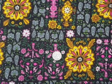 catalog photo of retro 60s vintage poly tricot knit fabric, India style print brights on black