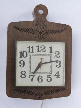 catalog photo of retro 70s vintage Timex kitchen wall clock, chip carved plastic frame