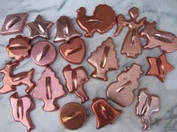 catalog photo of retro 70s vintage copper colored aluminum cookie cutters, large lot