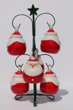 catalog photo of retro ceramic holiday spice set, Christmas Santa shakers hanging ornaments on rack