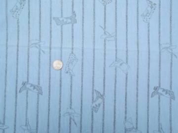 catalog photo of retro cowboy western theme fabric, light chambray blue w/ fine pencil drawn print