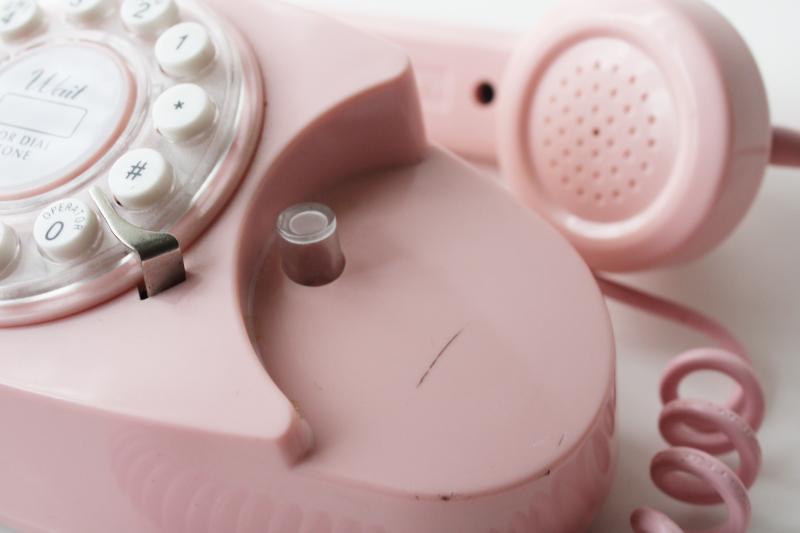 photo of retro style pink princess phone, touch tone 2015 Crosley remake of vintage telephone #3