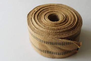 catalog photo of roll of jute webbing, burlap texture natural brown w/ black striping 