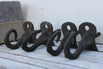 catalog photo of rustic antique iron hooks, curved pigtail shape primitive barn pulley rope hanger