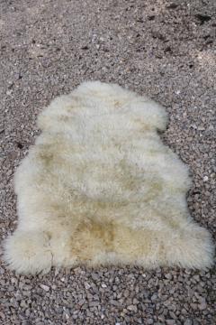 catalog photo of rustic boho decor sheepskin hide soft fur rug or mat, fluffy natural wool 