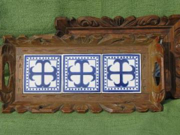 catalog photo of rustic carved wood trays w/ blue and white hand-painted Mexican tiles