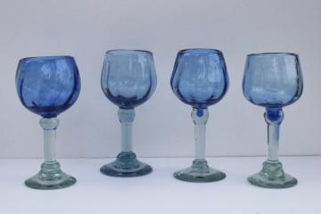 catalog photo of rustic handcrafted blown glass goblets, pale cobalt sea glass green recycled glass wine glasses