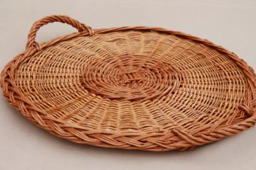 catalog photo of rustic natural wicker basket tray, serving tray w/ handles, holds a large deli platter or pizza