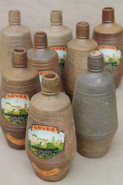 catalog photo of rustic old French country wine label stoneware bottles, vintage Portugal pottery