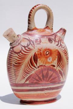 catalog photo of rustic vintage Mexican pottery water bottle or wine jug, flat canteen shape painted earth colors