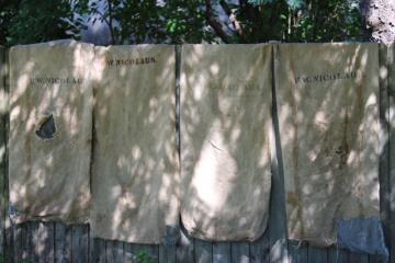 catalog photo of rustic vintage cotton grain sacks, coffee brown stripe feed bags patched primitive antique fabric