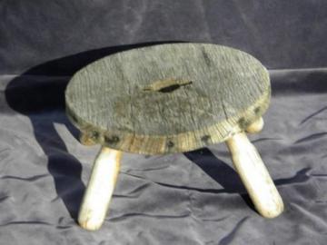 catalog photo of rustic vintage goat milking stool, nice primitive wood low stand plant table