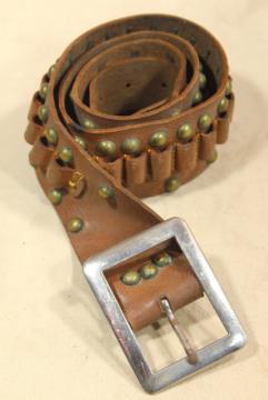 catalog photo of rustic vintage leather cartridge belt, mid-century hunting / cowboy gear