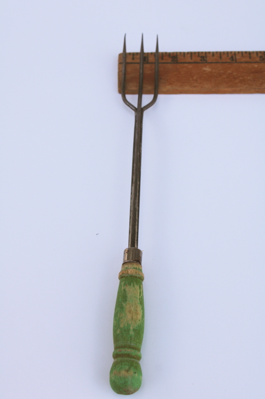 photo of rustic vintage toasting fork or campfire marshmallow toaster, old green paint wood handle #4