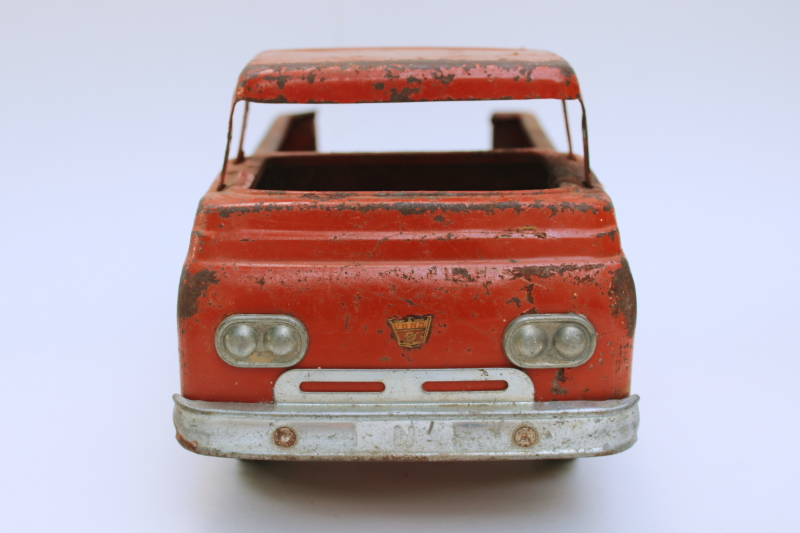 photo of rusty crusty vintage Nylint metal toy truck, mid century vintage Ford farm truck worn old red paint  #2