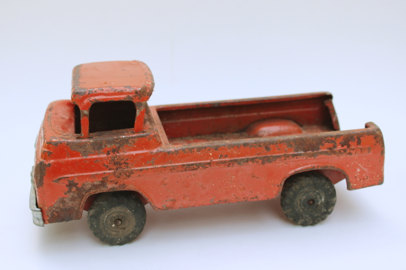 photo of rusty crusty vintage Nylint metal toy truck, mid century vintage Ford farm truck worn old red paint  #3