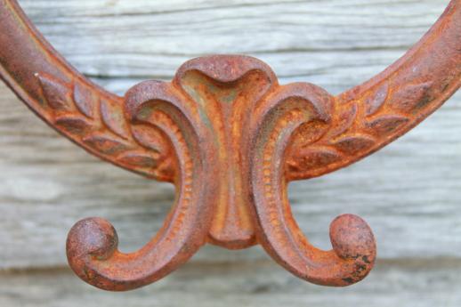 photo of rusty old antique iron coat hook, ornate vintage cast iron hardware double hook #5