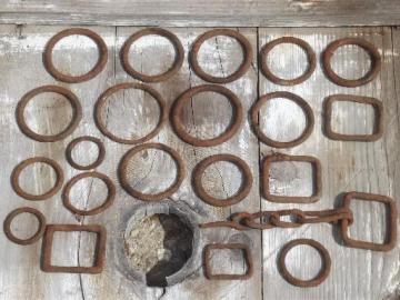 catalog photo of rusty old iron hardware lot, primitive antique harness rings collection