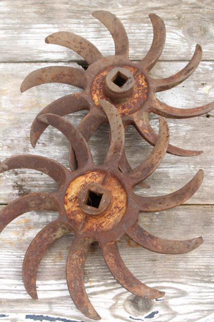 photo of rusty old iron sunburst gear wheels w/ curved blades machine age industrial #1