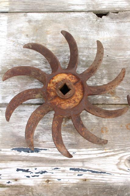 photo of rusty old iron sunburst gear wheels w/ curved blades machine age industrial #4