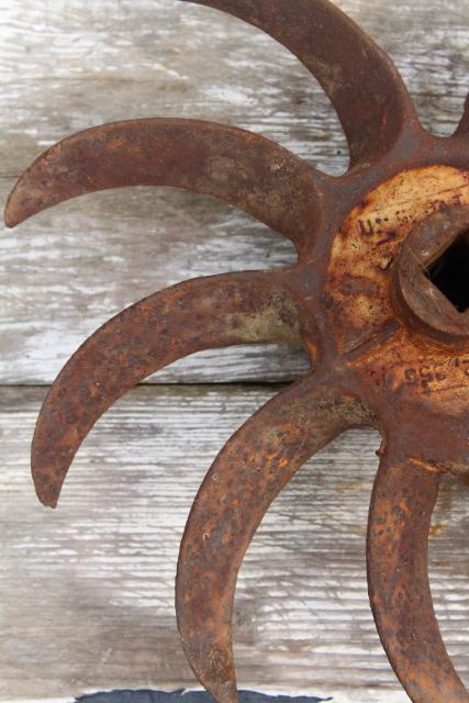 photo of rusty old iron sunburst gear wheels w/ curved blades machine age industrial #6