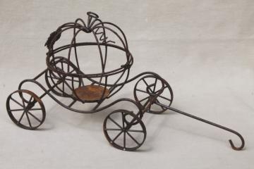 catalog photo of rusty rustic metal wire Cinderella pumpkin coach, enchanted garden ornament decor