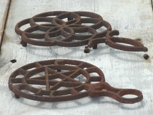 photo of rusty vintage cast iron trivets, star in circle & large flower #5