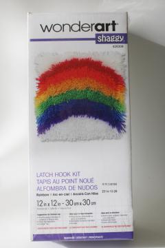 catalog photo of sealed latch hook kit, retro rainbow rya rug style shaggy pile throw pillow