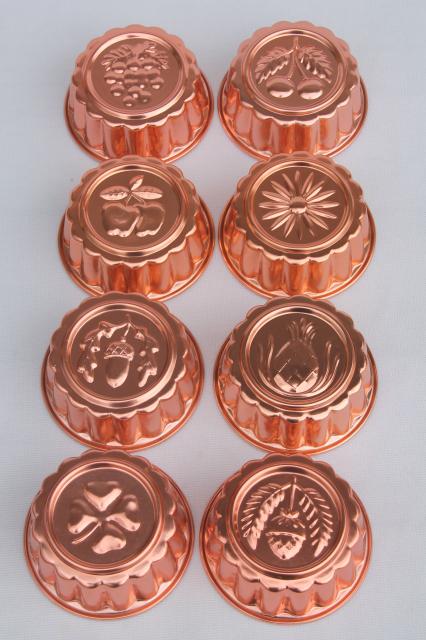 photo of set of 8 small metal jello molds, copper pink aluminum gelatin food mold lot #1