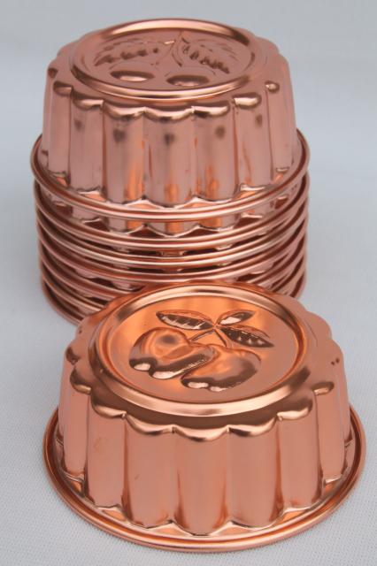 photo of set of 8 small metal jello molds, copper pink aluminum gelatin food mold lot #2