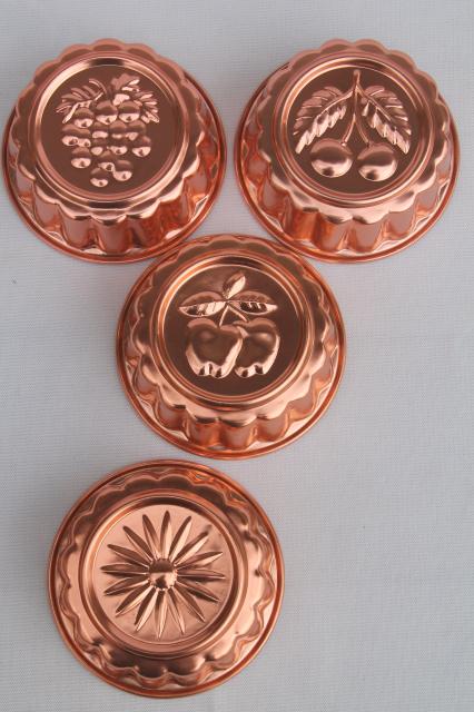 photo of set of 8 small metal jello molds, copper pink aluminum gelatin food mold lot #3