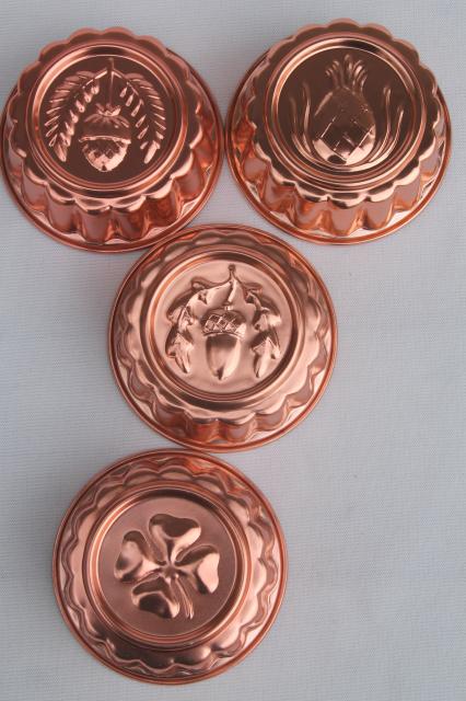 photo of set of 8 small metal jello molds, copper pink aluminum gelatin food mold lot #4