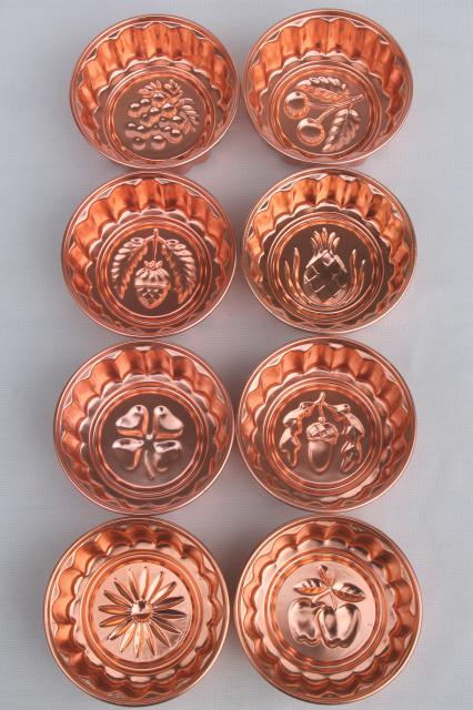 photo of set of 8 small metal jello molds, copper pink aluminum gelatin food mold lot #5