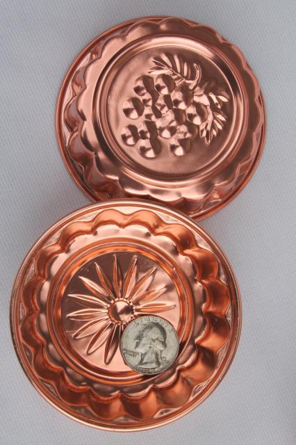 photo of set of 8 small metal jello molds, copper pink aluminum gelatin food mold lot #6