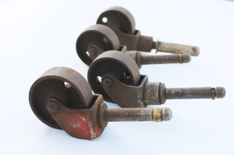 photo of set of four antique iron wheels furniture casters vintage industrial steel hardware #2